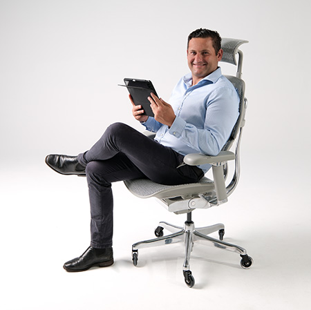 Ergohuman 2 Elite Platinum office chair with man and ipad
